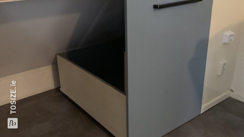 Storage bins for sloping roof, by Arie