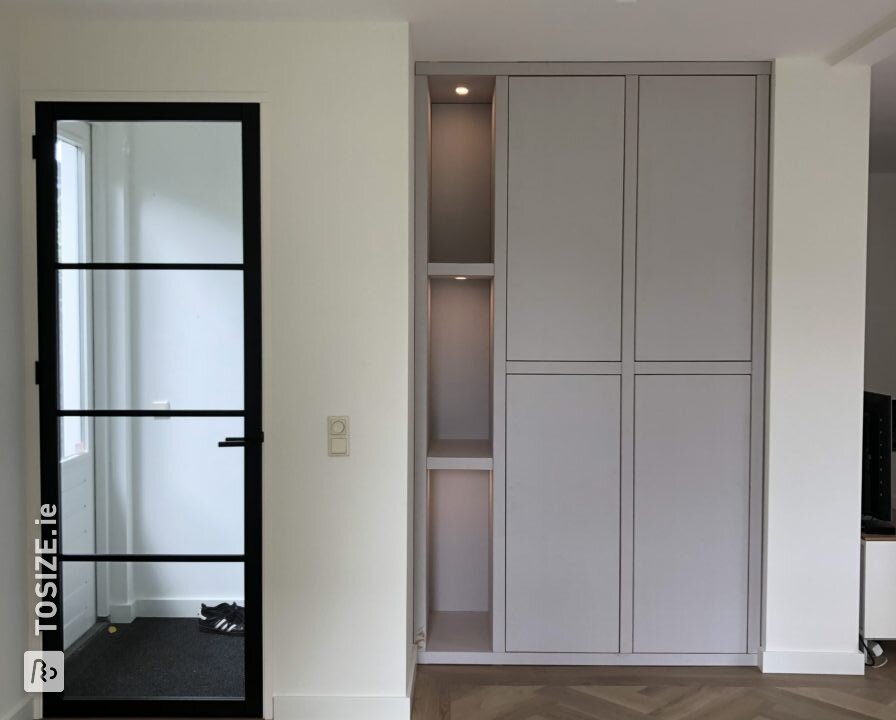 Built-in cabinet with lighting by Arian