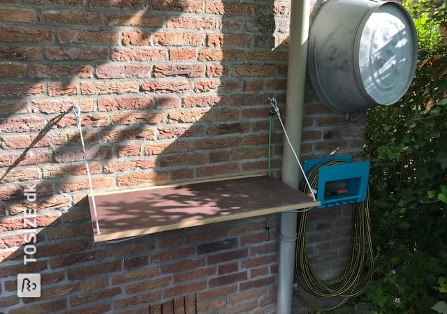 Practical fold-out shelf at standing height for the garden, by Ronald