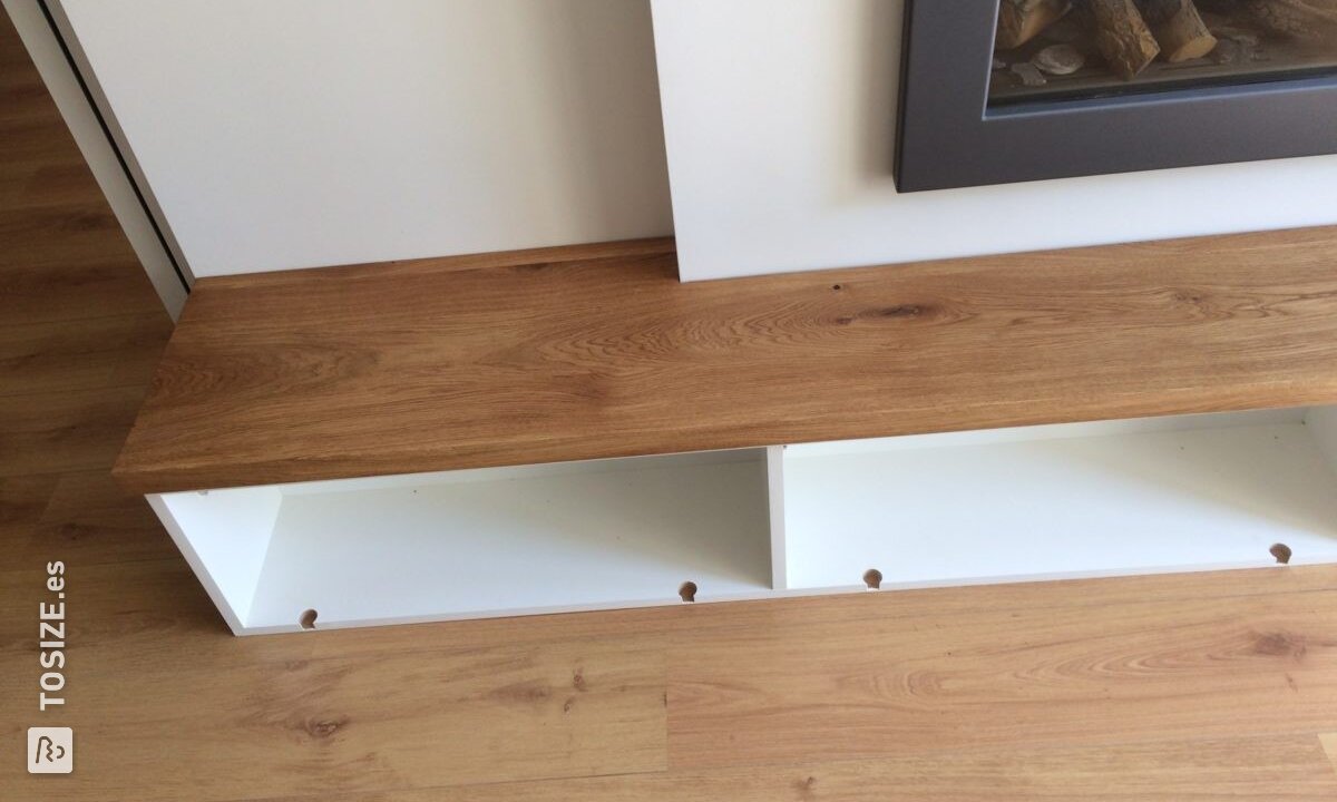 Mueble de TV alrededor de la chimenea, de René