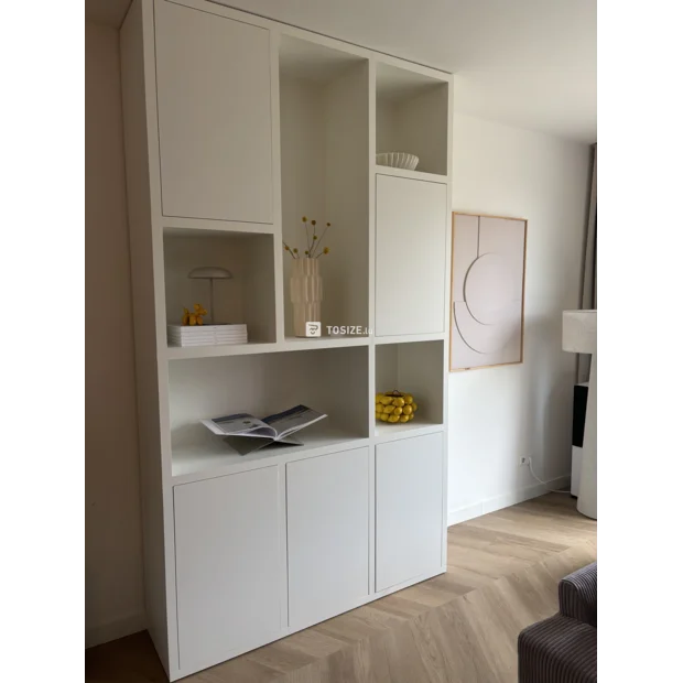 White cupboard wall with doors and open compartments