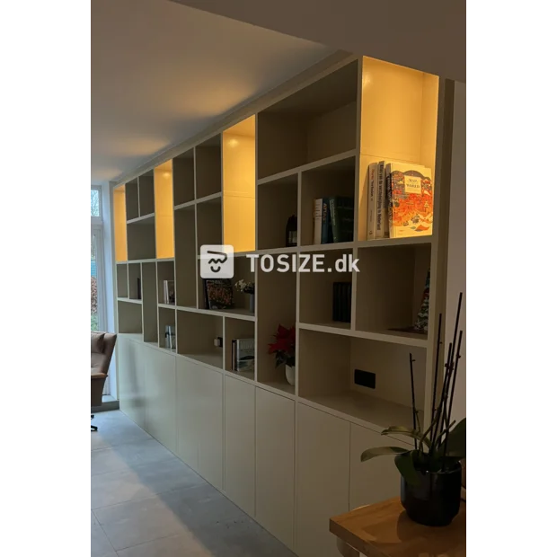 Cream cupboard wall with open compartments and doors