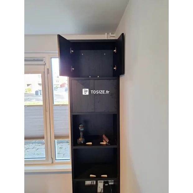 Black cupboard wall with doors and open compartments