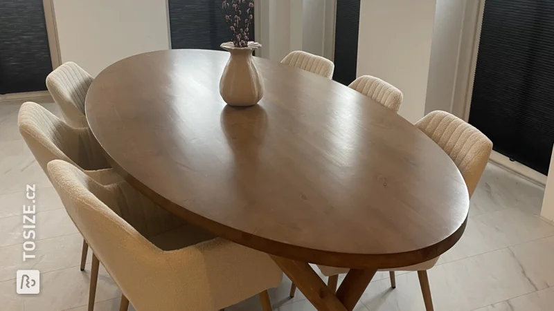 Make your own oval-shaped, dark brown dining table, by Eva