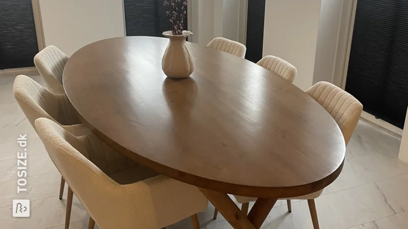 Make your own oval-shaped, dark brown dining table, by Eva