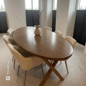 Make your own oval-shaped, dark brown dining table, by Eva