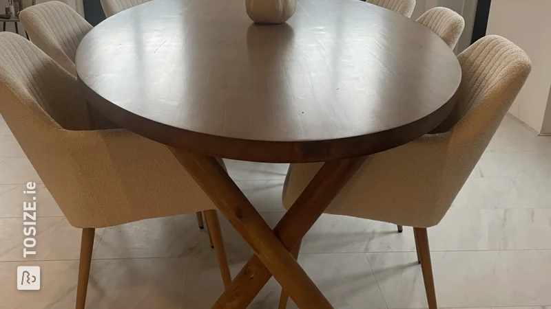 Make your own oval-shaped, dark brown dining table, by Eva