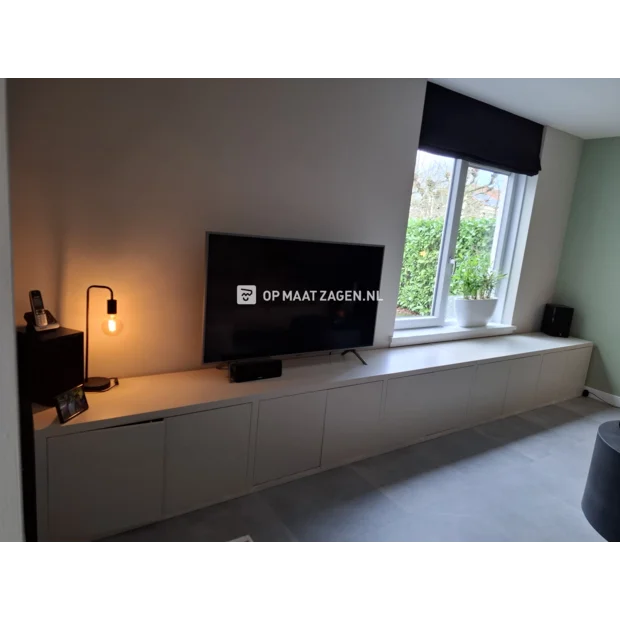 White cupboard wall with doors and open compartments