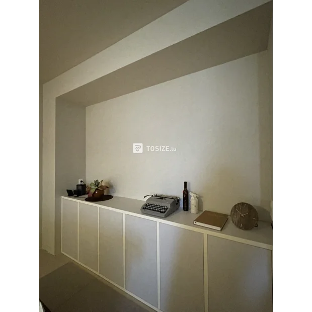 White sideboard with doors and open compartments