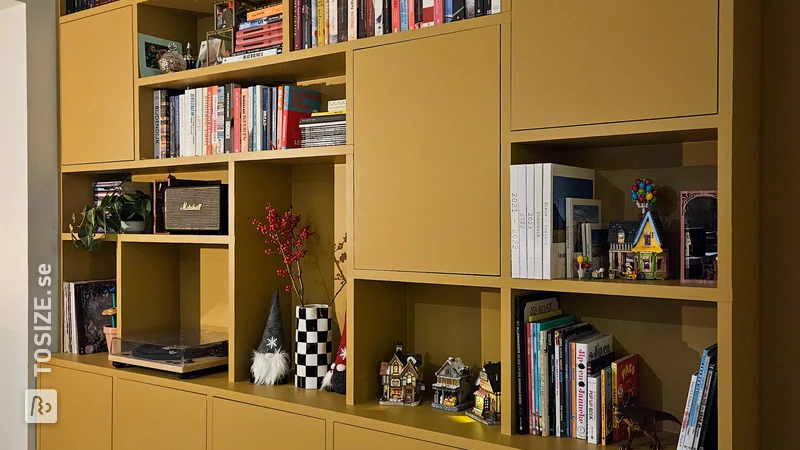 Yellow sleek bookcase for the living room, by Karien