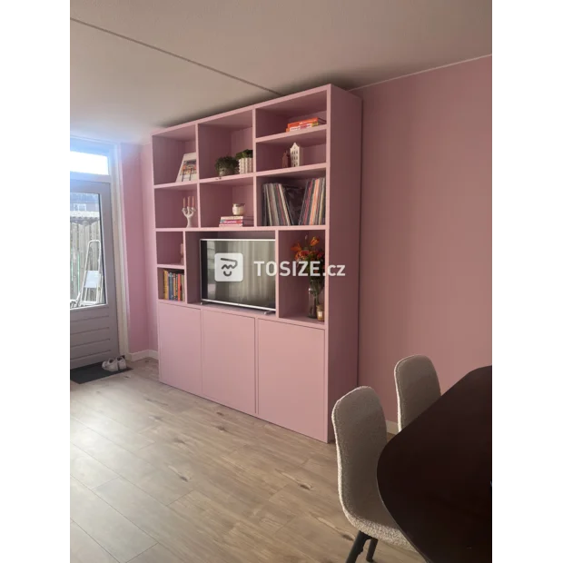 Pink cupboard wall with open compartments and doors