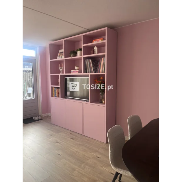 Pink cupboard wall with open compartments and doors