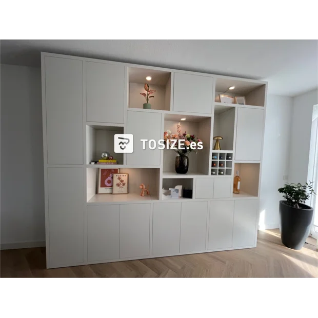 White cupboard wall with open compartments and doors