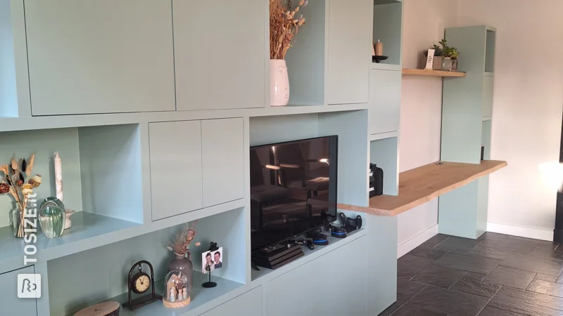 Custom made green shelving unit with desk, by Ellen