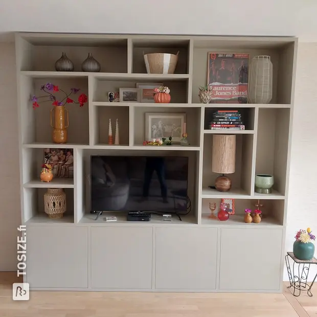 Gray cupboard wall with open compartments and doors