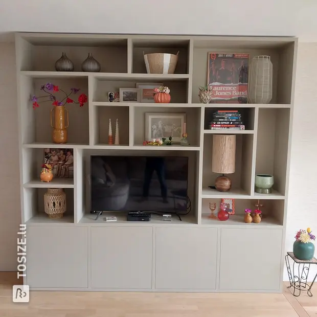 Gray cupboard wall with open compartments and doors