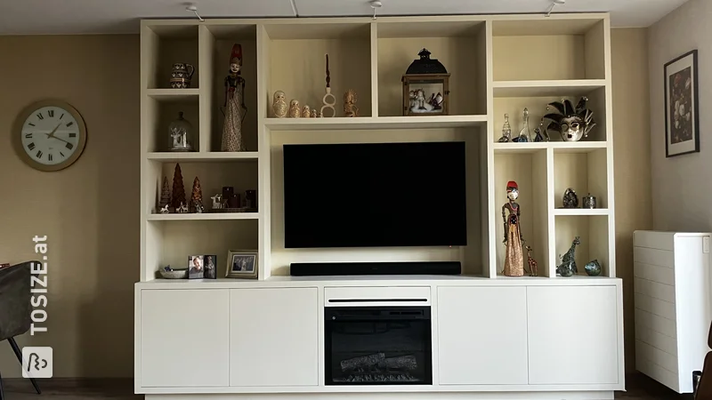 Stylish TV cabinet and wall unit with built-in fireplace and LED, by Arjan