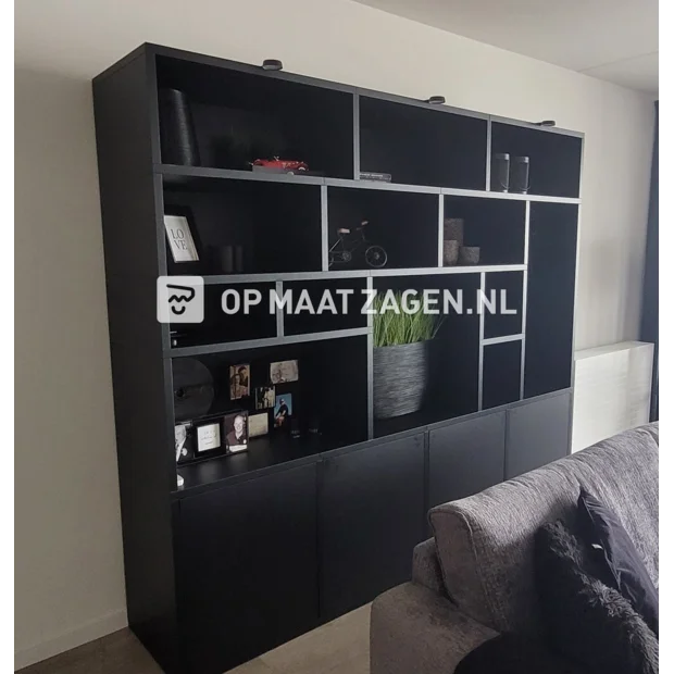 Black cupboard wall with open compartments and doors