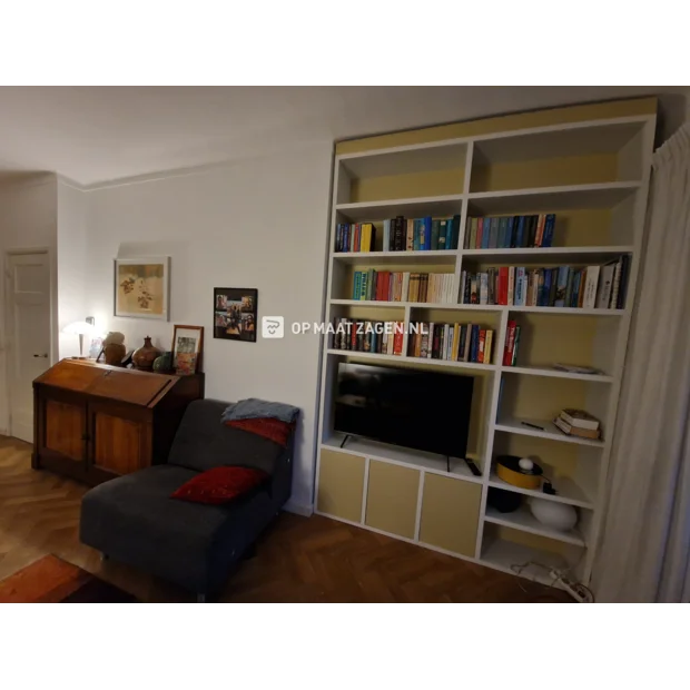 Yellow cupboard wall with open compartments and doors