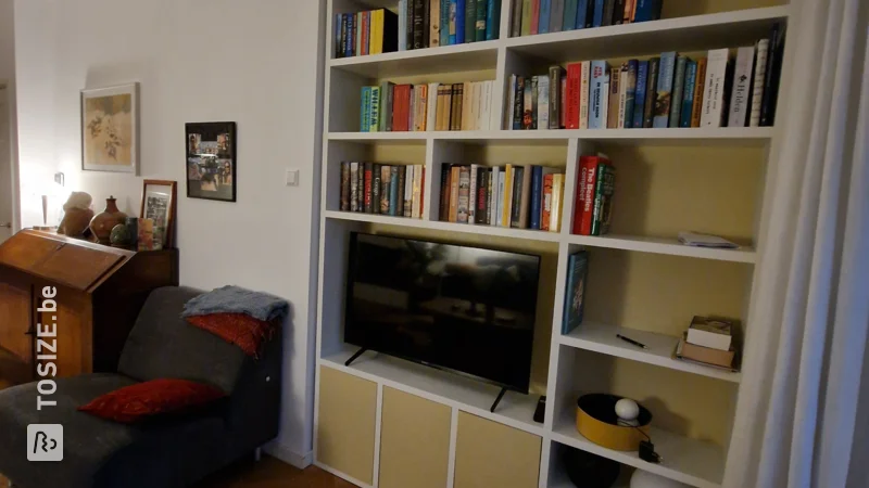 White and Yellow Bookcase with TV, by Ingrid