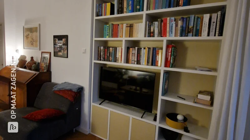 White and Yellow Bookcase with TV, by Ingrid