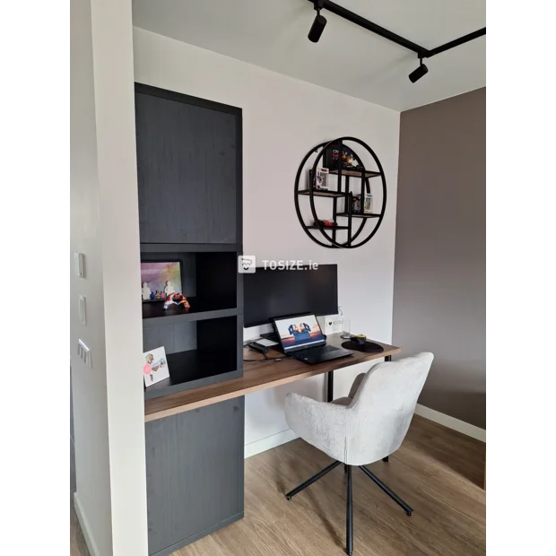 Black cupboard wall with open compartments and shelves