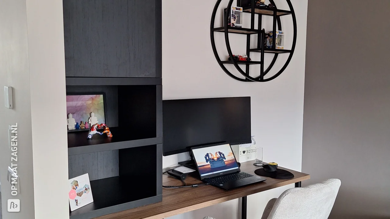 Stylish black cabinet with integrated desk top, by Marcel