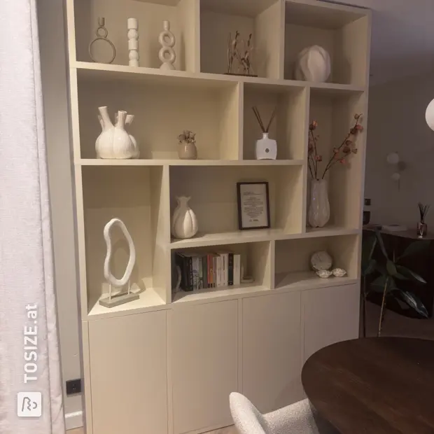 Cream cupboard wall with open compartments and doors