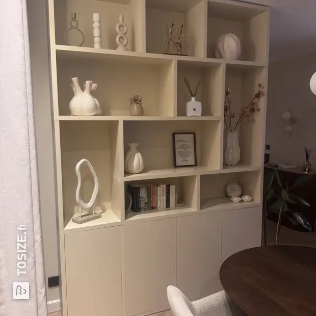 Cream cupboard wall with open compartments and doors