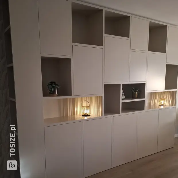 White shelving unit with open compartments and doors