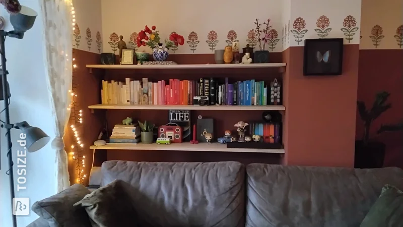 Unique oak bookshelves in niche, by Anne