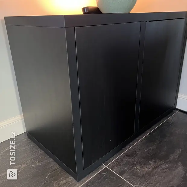 Black sideboard with doors and open compartments