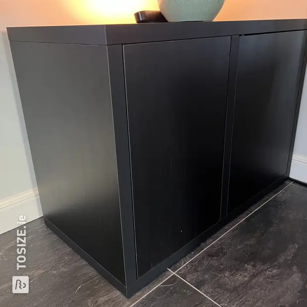 Black sideboard with doors and open compartments