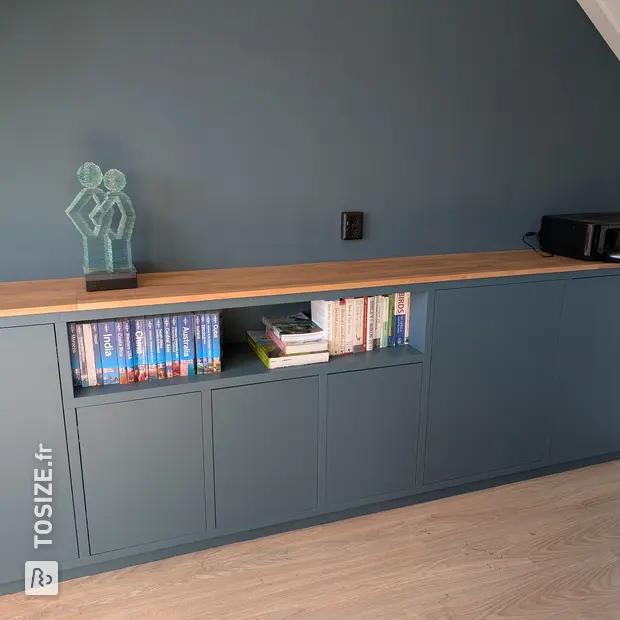 Green sideboard with open compartments and doors
