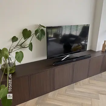 Stylish TV cabinet for an uneven wall, by Dennis