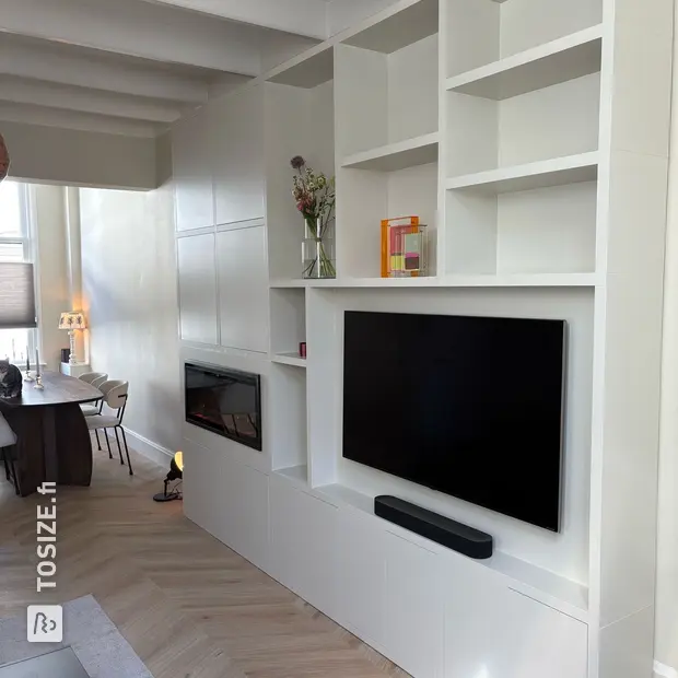 White cupboard wall with open compartments and doors