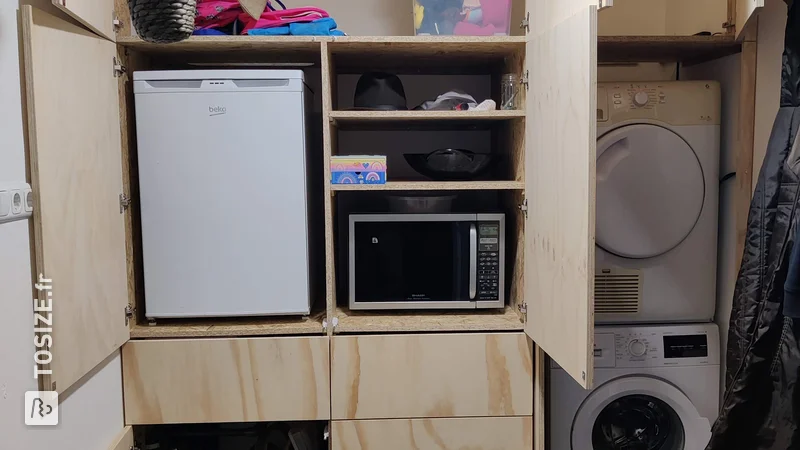 Utility room transformation with practical underlayment cupboard wall, by Ben