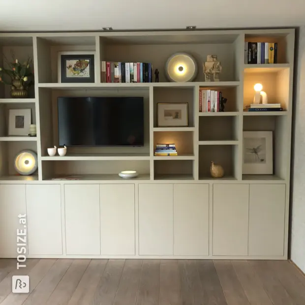 Cream cupboard wall with open compartments and doors