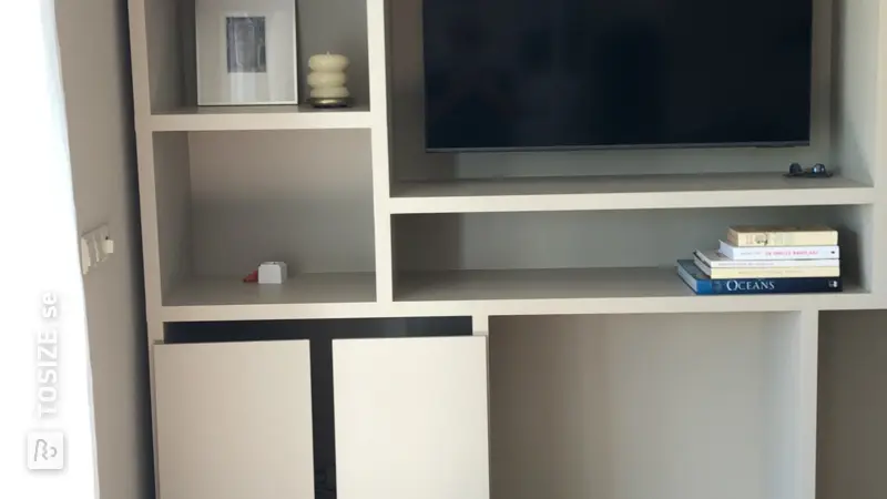 Custom made living room shelving unit by Joost