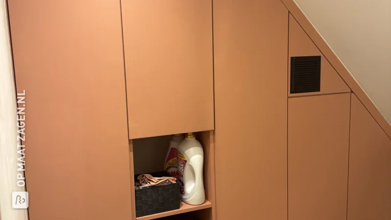 Practical attic cupboard under the knee wall for the central heating boiler, by Hein