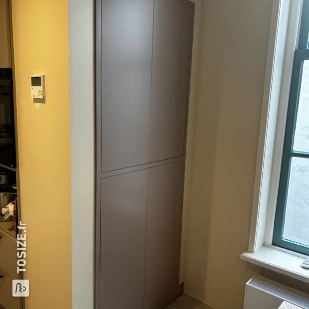 Beige cabinet with doors and shelves
