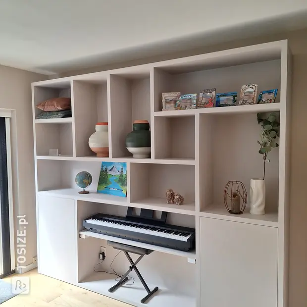 White shelving unit with open compartments and doors