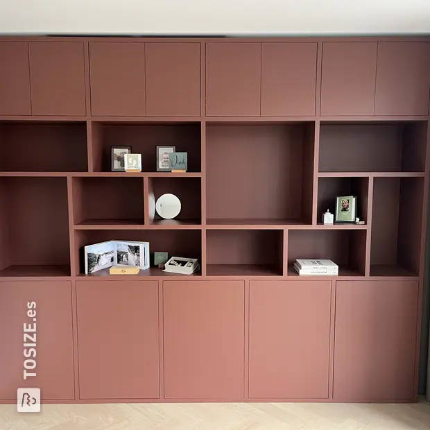 Red cupboard wall with doors and open compartments