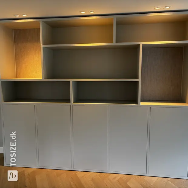 Gray cabinet with doors and open compartments
