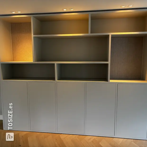 Gray cabinet with doors and open compartments