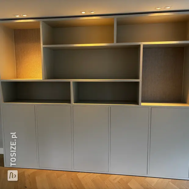 Gray cabinet with doors and open compartments