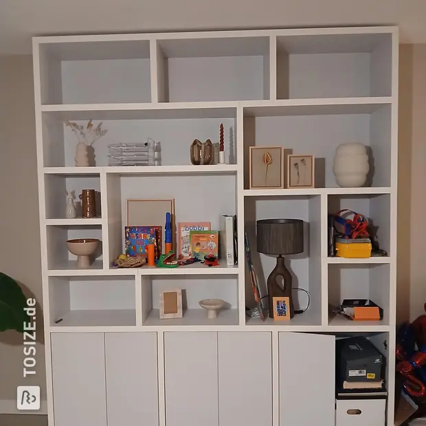 White cupboard wall with doors and open compartments