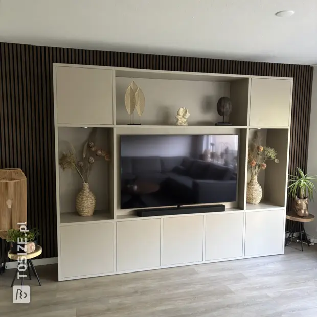 Cream cupboard wall with open compartments and doors