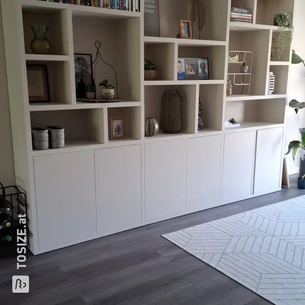 Cream cupboard wall with open compartments and doors