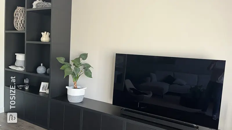 Stylish black wall unit for the living room, by Brenda
